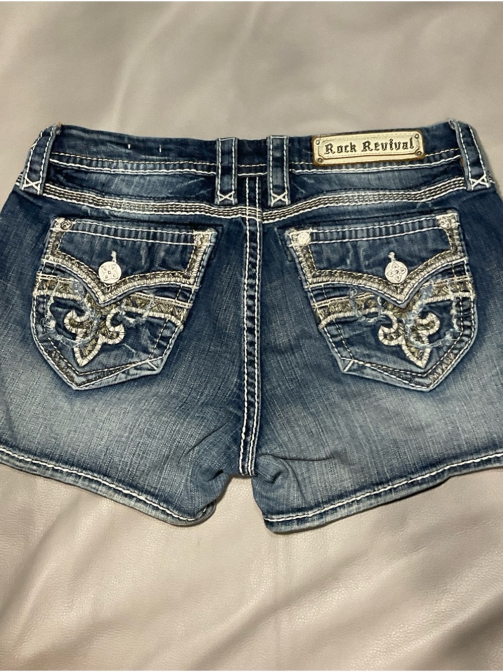 Rock Revival Women's Distressed Blue Jean Shorts with Embroidered Pockets